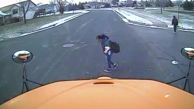 VIDEO: Driver fails to stop for school bus, nearly hits 6th grader