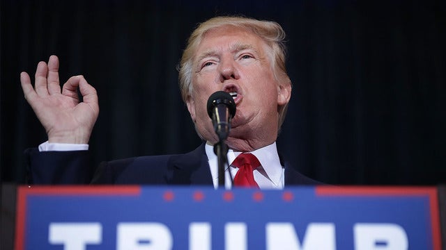 Ex-campaign worker for Trump sues over unwanted kiss claim