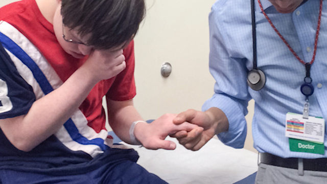 Photo captures ‘beautiful' moment between young cancer survivor and his doctor
