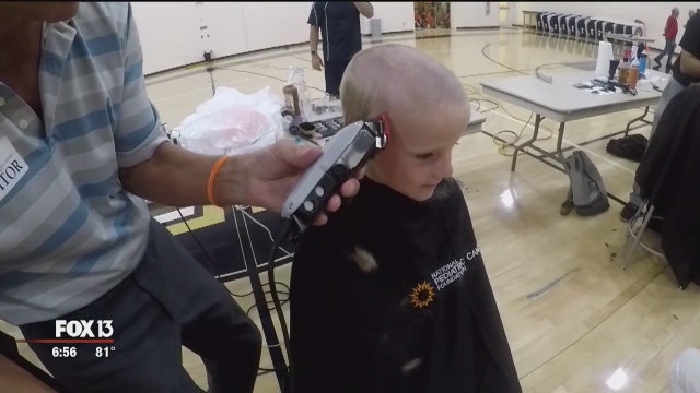 Shaving heads raises money for cancer research