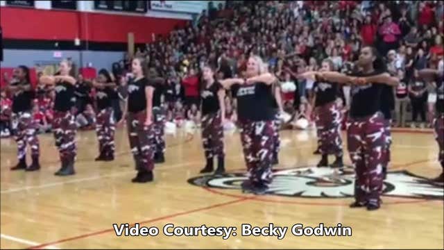 Principal joins step team for awesome performance in crowded gymnasium
