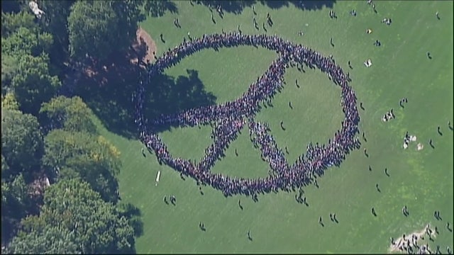 Human peace sign in Central Park