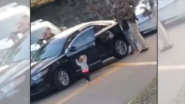 Toddler exits truck with hands up after parents are arrested by Tallahassee police