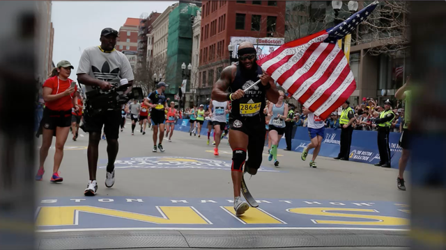 A retired Marine who lost his leg in Afghanistan ran the Boston Marathon carrying the American flag