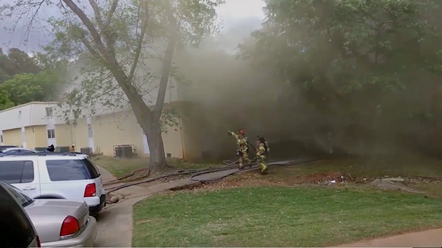 Firefighter catches baby from burning building