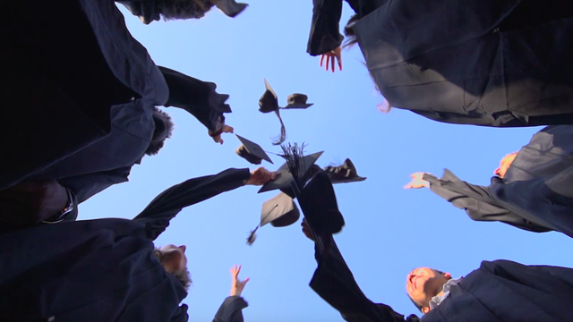 Veteran walks in graduation 61 years after being drafted