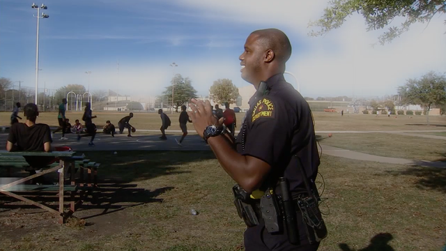 Officer gives out turkeys to neighborhood that raised him