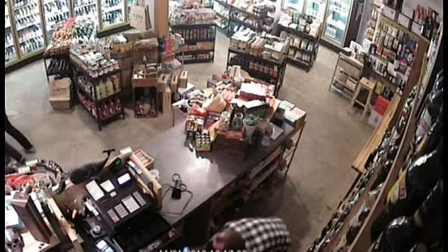 WATCH: Store owner takes down armed robber