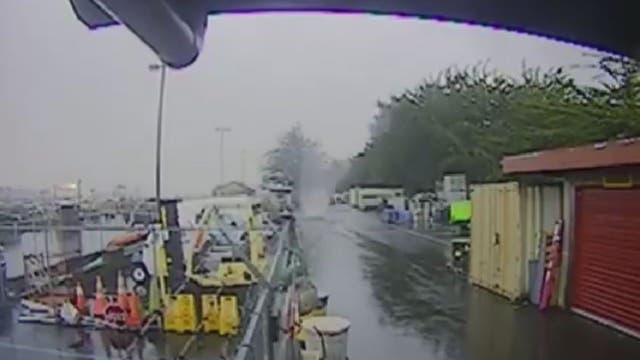 Marina cameras track waterspout as it moves over land