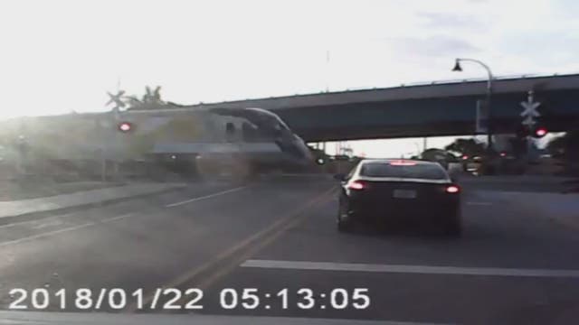 WATCH: Truck tries to beat oncoming train