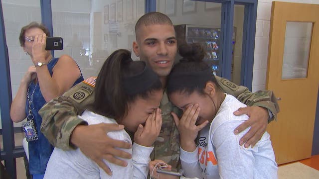 Soldier returns from Iraq to surprise twin sisters at Virginia high school