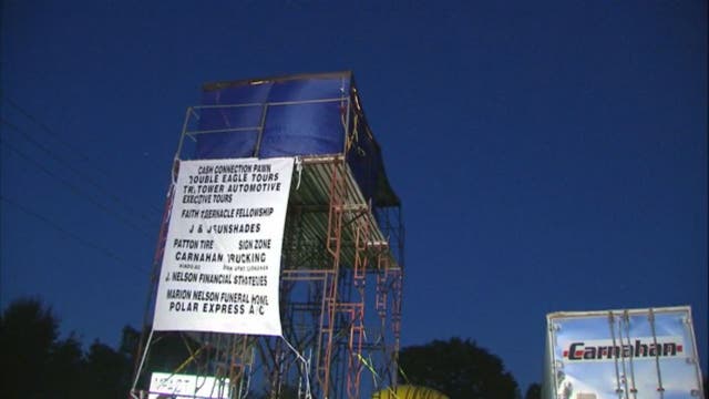 11-year-old boy camps on billboard to raise money for charity