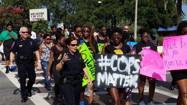 Local police and black leaders march for unity