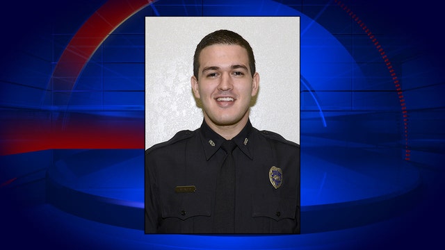 Officer shot in standoff is still in coma but is responsive