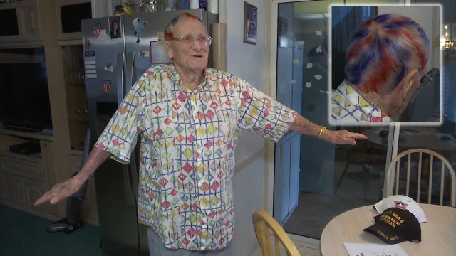 WWII vet goes red, white and blue for honor flight