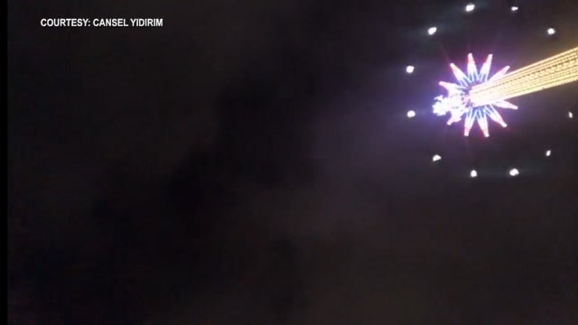 Woman drops cellphone 450 feet aboard world's tallest swing ride