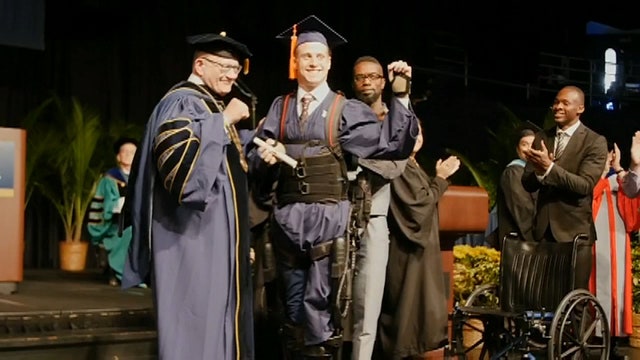 Paralyzed FIU student uses exoskeleton to cross stage for graduation