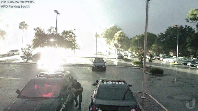 Lightning strike a little too close for comfort for police officer