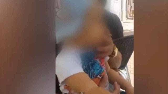 Shocking video of baby smoking, drinking