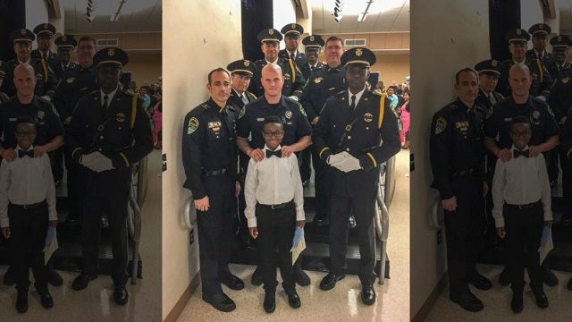Police officers attend boy's 5th grade graduation in place of fallen father