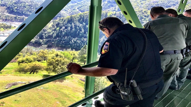 Woman falls 60 feet from bridge while taking selfie