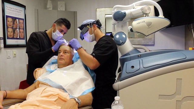 This robot helps regrow hair