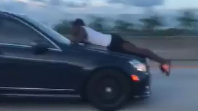 VIDEO: Man rides on hood of car going 70 mph on Florida interstate