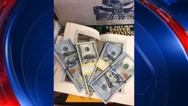 Woman finds $4K in book, tracks down owner and returns money