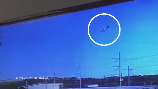 Surveillance video shows military cargo plane plummeting