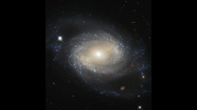 Hubble space telescope captures stunning image of barred spiral galaxy