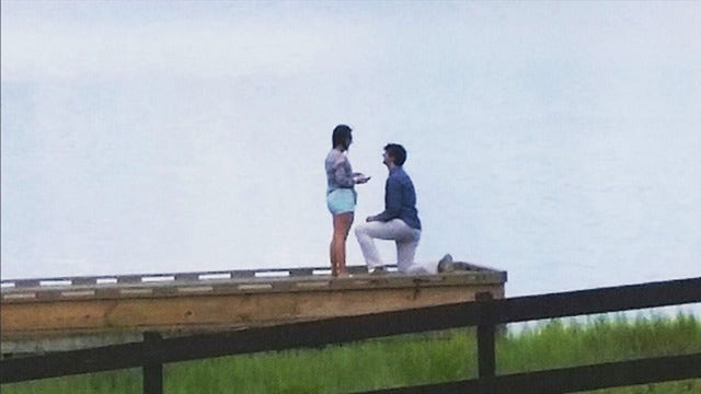 Passerby snaps photo of proposal, hopes to share