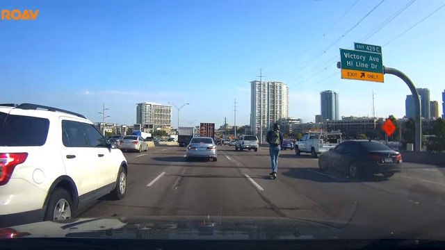 Dash camera captures scooter rider on busy Dallas interstate