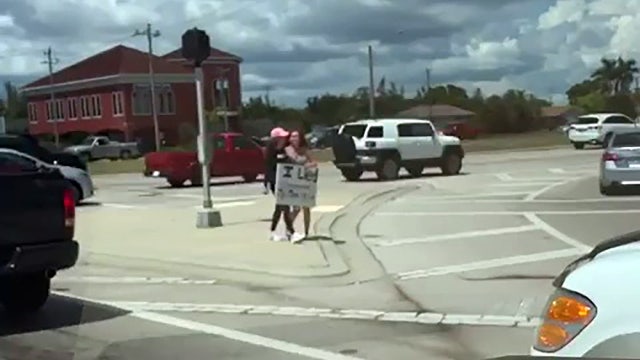 Tough love? Florida woman makes daughter carry 'I lied' sign in public