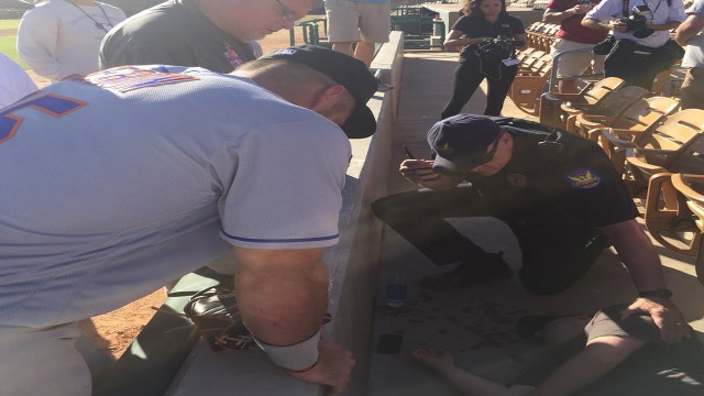 VIDEO: Tebow tends to fan who suffered seizure at game; witnesses report "miracle"