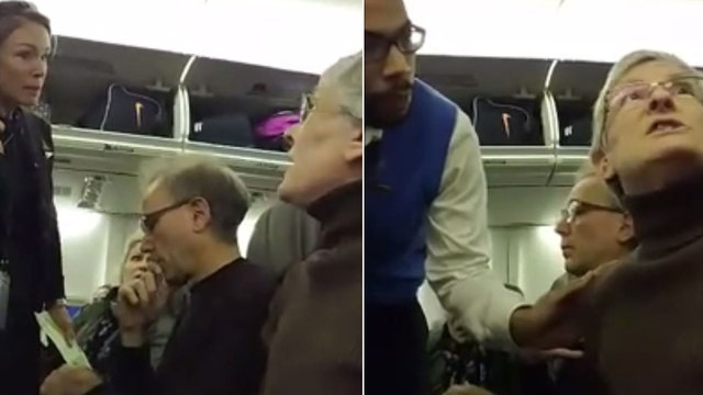 WATCH: Woman thrown off plane for berating Trump supporter seated next to her