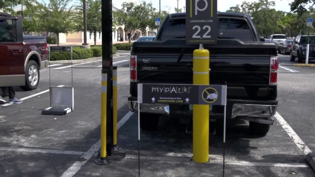 Outlet mall debuts app that allows shoppers to reserve parking spaces