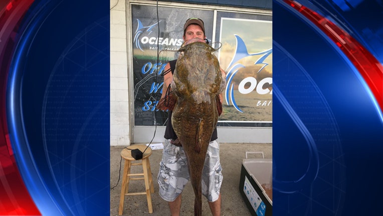 f8c0cfea-Jeffrey Dill and the catfish he caught_1527719641156.jpg-408200.jpg