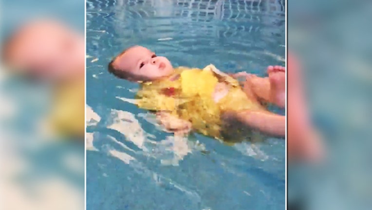 6ef19589-baby struggles to swim_1462554770520.jpg