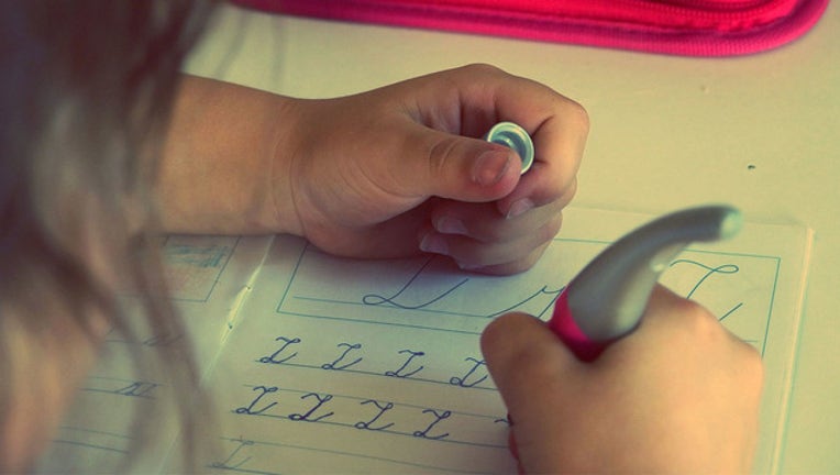 b946e9a6-chlid writing stock photo_1519651030092.jpg.jpg