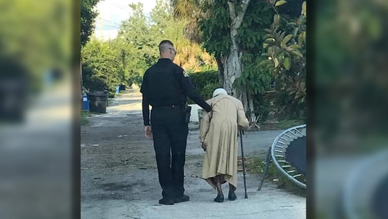 4d5d6915-sppd officer walks woman home_1567114228918.jpg.jpg