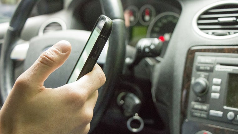 f8d90c37-texting while driving stock photo_1522847062316.jpg.jpg