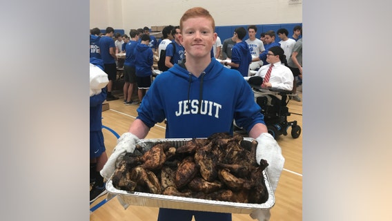 Jesuit students package thousands of meals at Metro Ministries