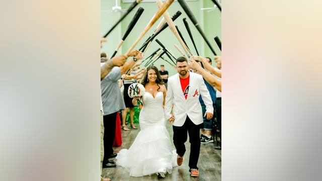 House divided: Yankees fan marries lifelong Atlanta Brave in epic baseball-themed wedding
