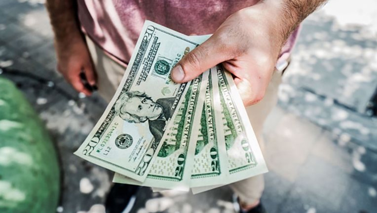 aa2f727f-blur-cash-close-up-545065_1571006086005.jpg