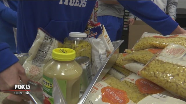 Jesuit High students pack Thanksgiving meals for hundreds of families in need