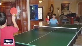 Brothers practice ping-pong hundreds of miles apart thanks to robotic pitching machine