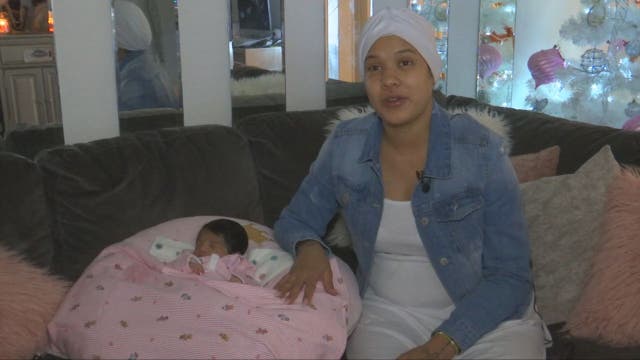 Mom who went into labor on plane returns home with newborn
