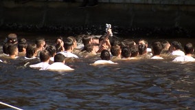 Spectators moved online for annual Epiphany celebration dive