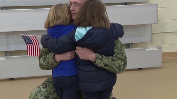 Dad surprises daughters after 10-month deployment