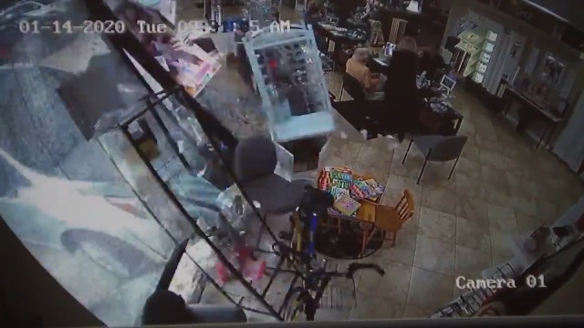 SUV crashes through storefront in Largo
